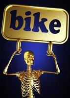 palavra de bicicleta e esqueleto dourado foto