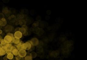 fundo de bokeh amarelo dourado há um brilho de luzes, idéias de festa de natal e ano novo. foto