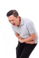homem asiático que sofre de dor de estômago, constipação, indigestão, foto