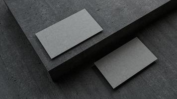 maquete em branco de cartões de visita na ilustração 3d de piso de concreto escuro foto