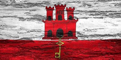 bandeira de gibraltar - bandeira de tecido acenando realista foto
