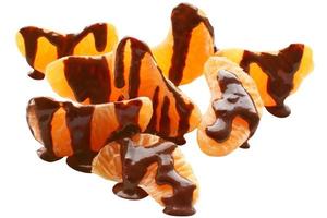 pilha de tangerina com cobertura em chocolate foto