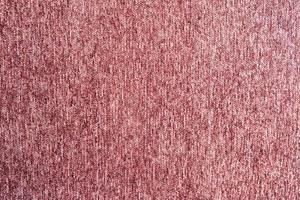 textura de pano de tapete vermelho rosa foto