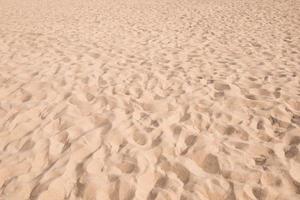 padrão de textura de areia fundo arenoso de praia foto