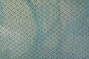 rede de metal de gaiola de textura. detalhe da grade cromada para construção. foto