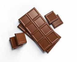 pedaços de chocolate ao leite e barra de chocolate isolados no fundo branco da ilustração 3d de vista superior foto