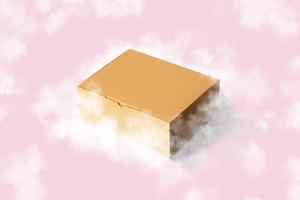 caixa de papelão marrom voando com nuvens no fundo rosa foto