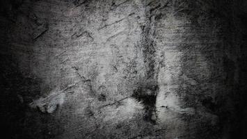 fundo escuro e assustador. parede de concreto preto escuro, textura de cimento de fundo de halloween assustador foto