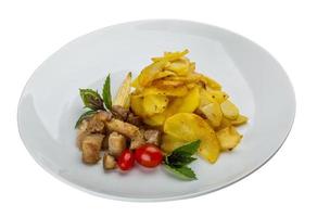 carne de porco frita com batata foto