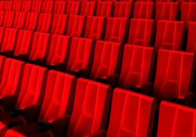 fileiras de assentos de veludo vermelho assistindo filmes no cinema com fundo de banner de espaço de cópia. conceito de entretenimento e teatro. renderização de ilustração 3D foto