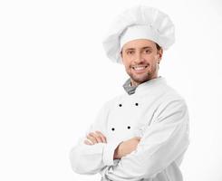um cozinheiro sorridente com os braços cruzados foto