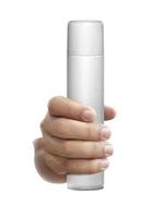 frasco de spray branco na mão isolado em um fundo branco foto