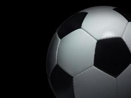 bola de futebol em fundo preto foto