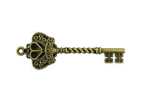 chave vintage chave dourada antiga no traçado de recorte de fundo branco foto