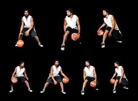 gesto de jogador de basquete asiático driblando sobre fundo preto. conceito de basquete na ásia foto