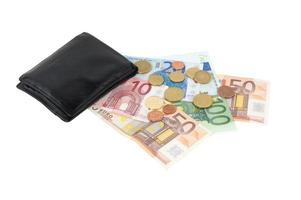 carteira com notas e moedas de euro foto
