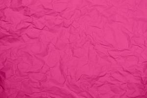 fundo de textura de papel amassado rosa. fundo de textura de papel enrugado rosa. fundo de textura de tecido de vinco rosa. fundo de textura de tecido rosa enrugado.