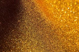fundo de glitter dourados, fundo abstrato de ouro com bokeh desfocado, luzes de bokeh abstratas com fundo de luz suave. foto