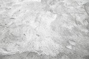 grunge de fundo de superfície de estuque cinza ou branco. textura de parede velha cinza sujo de cimento com fundo preto. parede de concreto cinza, fundo de textura abstrata foto