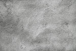 grunge de fundo de superfície de estuque cinza ou branco. textura de parede velha cinza sujo de cimento com fundo preto. parede de concreto cinza, fundo de textura abstrata foto
