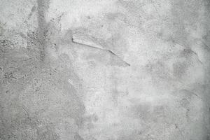 grunge de fundo de superfície de estuque cinza ou branco. textura de parede velha cinza sujo de cimento com fundo preto. parede de concreto cinza, fundo de textura abstrata foto