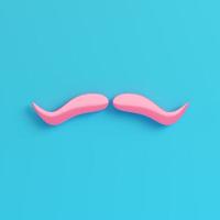 bigode falso rosa sobre fundo azul brilhante em tons pastel foto