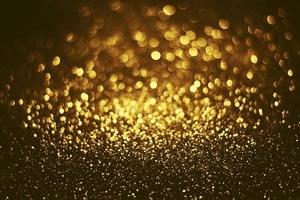 textura de iluminação de bokeh de brilho dourado turva fundo abstrato para aniversário, aniversário, casamento, véspera de ano novo ou natal foto