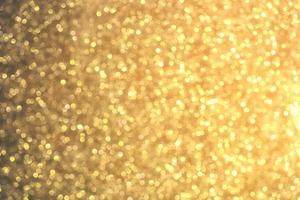 textura de iluminação de bokeh de brilho dourado turva fundo abstrato para aniversário, aniversário, casamento, véspera de ano novo ou natal foto