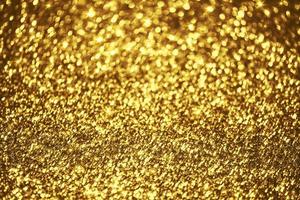 textura de iluminação de bokeh de brilho dourado turva fundo abstrato para aniversário, aniversário, casamento, véspera de ano novo ou natal foto