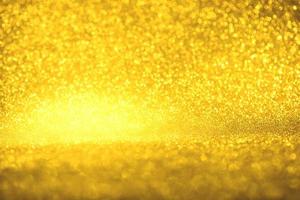 textura de iluminação de bokeh de brilho dourado turva fundo abstrato para aniversário, aniversário, casamento, véspera de ano novo ou natal foto