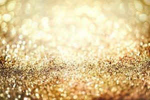 textura de iluminação de bokeh de brilho dourado turva fundo abstrato para aniversário, aniversário, casamento, véspera de ano novo ou natal foto