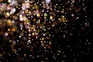 textura de iluminação de bokeh de brilho dourado turva fundo abstrato para aniversário, aniversário, casamento, véspera de ano novo ou natal foto