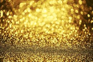 textura de iluminação de bokeh de brilho dourado turva fundo abstrato para aniversário, aniversário, casamento, véspera de ano novo ou natal foto