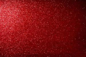 luzes de bokeh de glitter vermelho borraram fundo abstrato para dia dos namorados, aniversário, aniversário, casamento, ano novo e natal foto