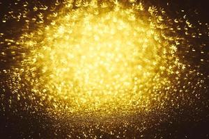 textura de iluminação de bokeh de brilho dourado turva fundo abstrato para aniversário, aniversário, casamento, véspera de ano novo ou natal foto