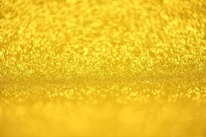 textura de iluminação de bokeh de brilho dourado turva fundo abstrato para aniversário, aniversário, casamento, véspera de ano novo ou natal foto