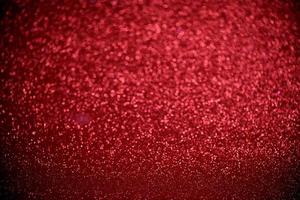 luzes de bokeh de glitter vermelho borraram fundo abstrato para dia dos namorados, aniversário, aniversário, casamento, ano novo e natal foto