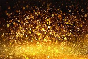 textura de iluminação de bokeh de brilho dourado turva fundo abstrato para aniversário, aniversário, casamento, véspera de ano novo ou natal foto