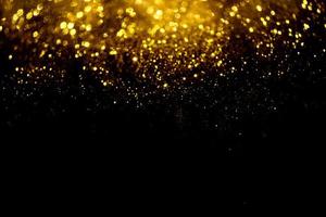 textura de iluminação de bokeh de brilho dourado turva fundo abstrato para aniversário, aniversário, casamento, véspera de ano novo ou natal foto