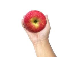 maçã na mão isolada no fundo branco foto