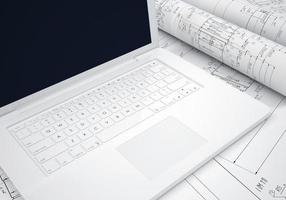 rola desenhos de engenharia e laptop
