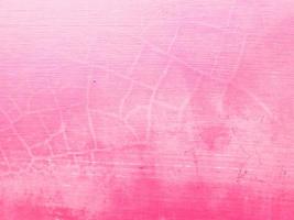 fundo de textura de concreto rosa pintado rachado e descascado foto