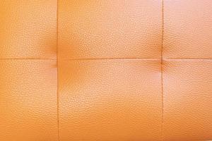 fundo de textura de espuma de capa de sofá laranja foto