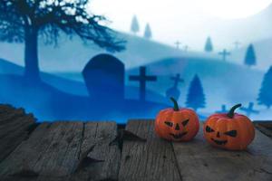 cemitério assustador com abóbora de halloween de brilho foto