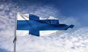 bandeira da finlândia - bandeira de tecido acenando realista. foto