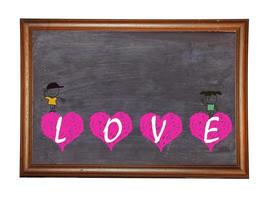 quadro-negro com mensagem de coração de amor escrita com giz foto