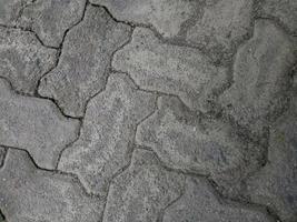 estradas de pavimentação de tijolos rachados e sujos foto