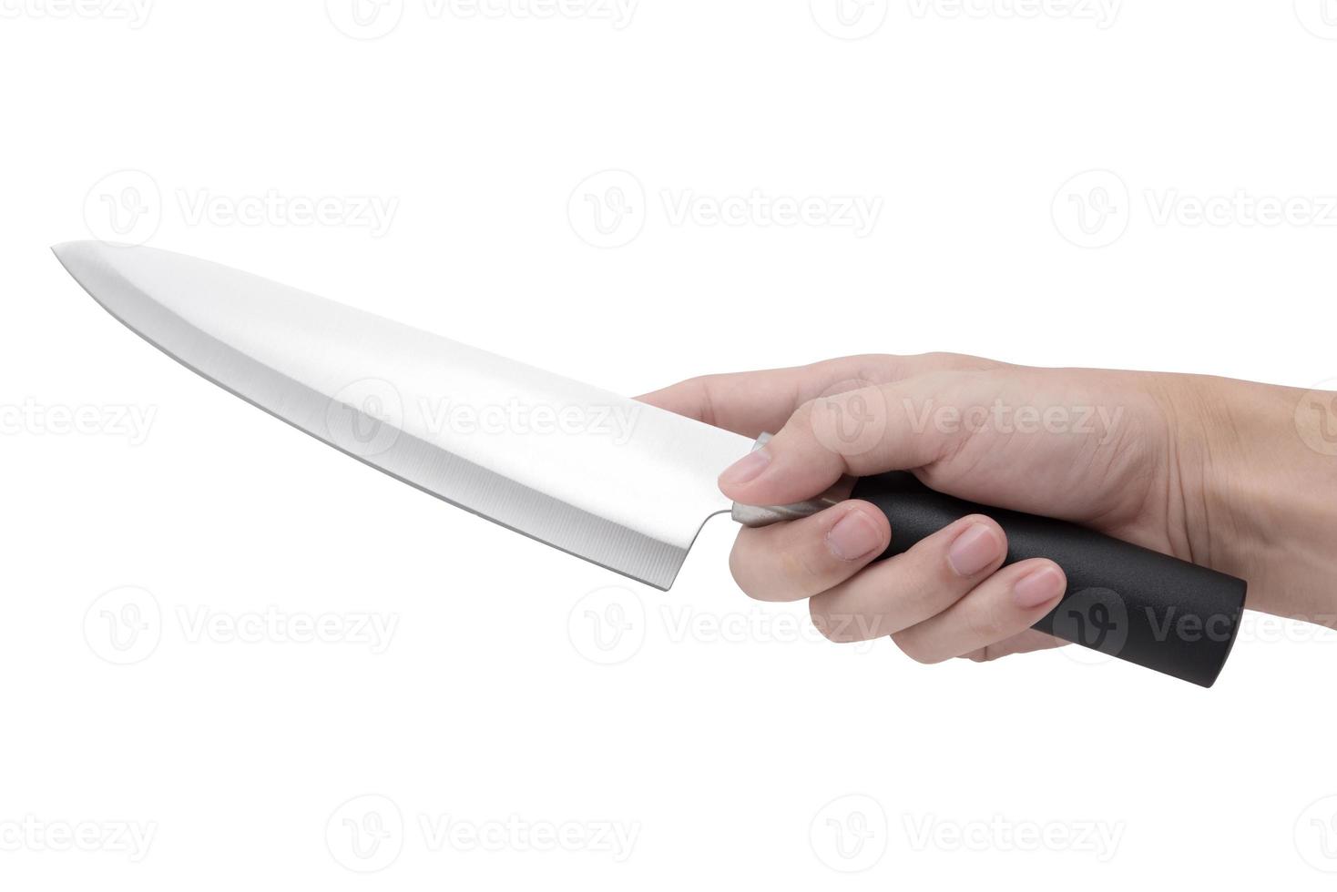 Hand hält ein Messer isoliert auf einem weißen Hintergrund foto