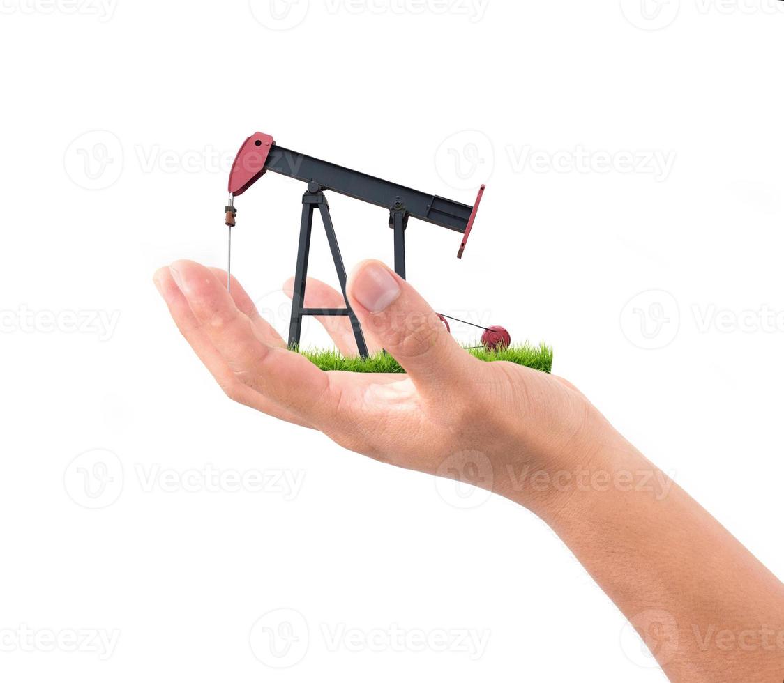 Pumpjack in der Hand halten foto