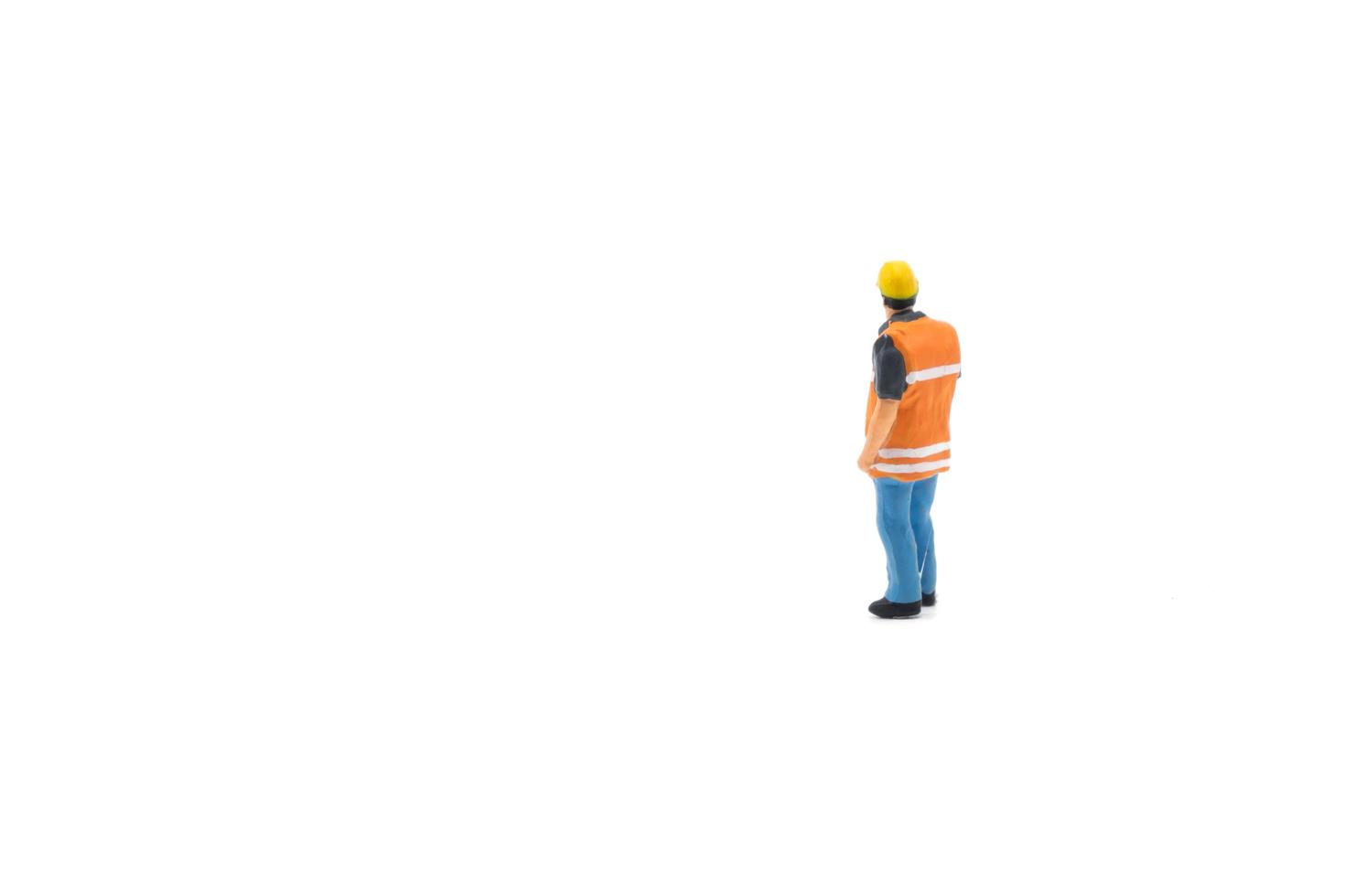 Miniatur Menschen Ingenieur Arbeiter Baukonzept isoliert auf weißem Hintergrund auf weißem Hintergrund foto
